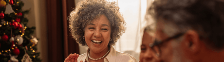 woman smiling at holiday dinner