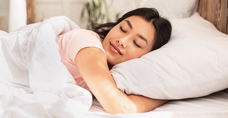 A woman sleeping in bed.