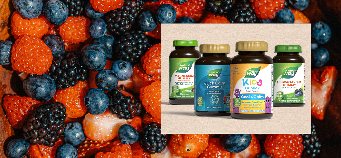 Supplement bottles with colorful berry background