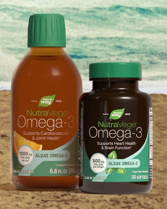 Two NutraVege Omega-3 supplement containers on a sandy beach-style background: a large amber liquid bottle with a green cap and a smaller dark bottle of softgels with a green cap. Both labels show NutraVege Omega-3 branding and dosage claims.
